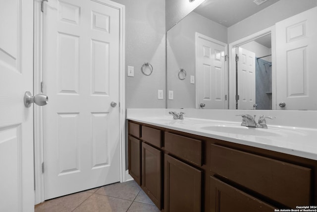 bathroom featuring tile patterned flooring and vanity