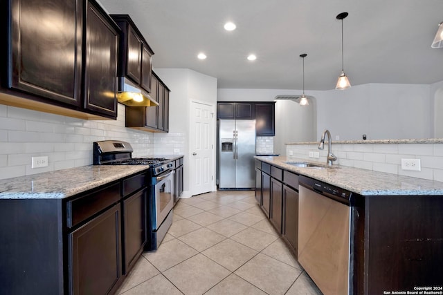 kitchen with sink, decorative light fixtures, light tile patterned floors, appliances with stainless steel finishes, and light stone countertops