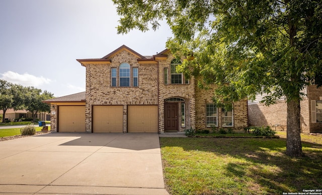 view of front of house featuring a front yard and a garage