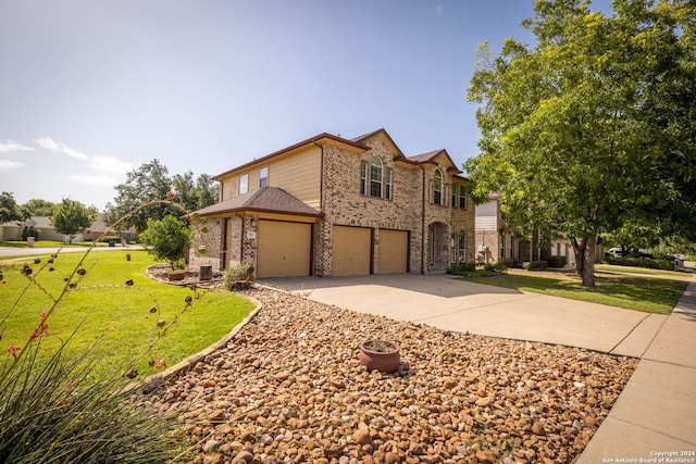 view of front of house featuring a front lawn and a garage