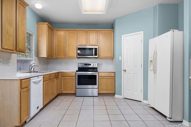 kitchen featuring sink, stainless steel appliances, and light tile patterned floors