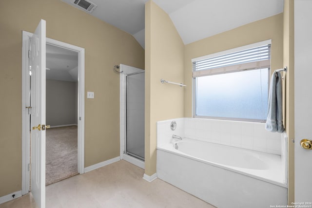 bathroom with independent shower and bath and vaulted ceiling