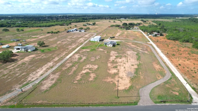 birds eye view of property with a rural view