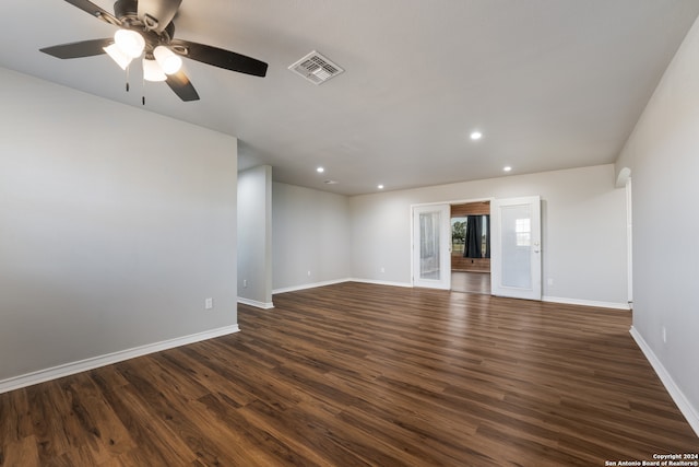 unfurnished room featuring dark hardwood / wood-style floors and ceiling fan