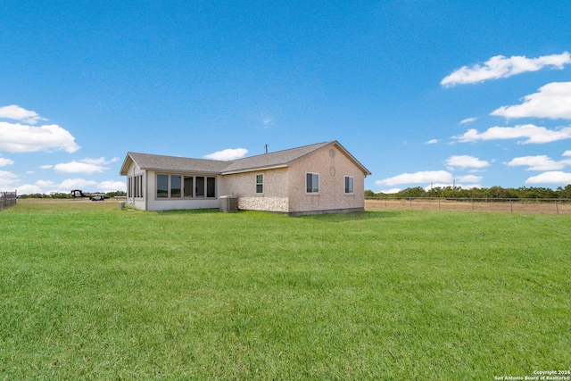 10886 Macaway Rd, Adkins, TX 78101 - rear view of property with central AC unit and stucco siding