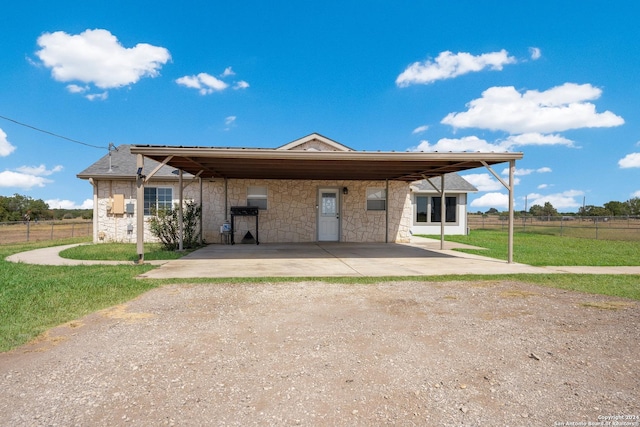 10886 Macaway Rd, Adkins, TX 78101 - view of front of property featuring driveway and stone siding