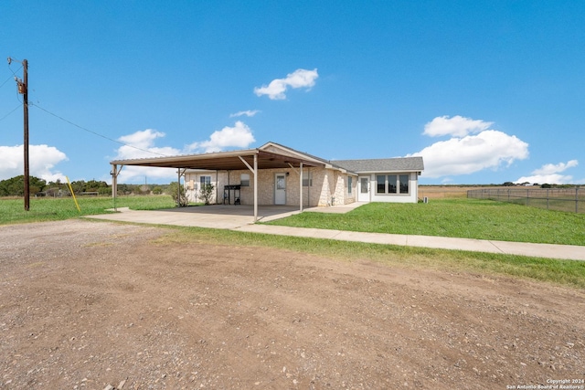 10886 Macaway Rd, Adkins, TX 78101 - view of front of property featuring dirt driveway and a carport