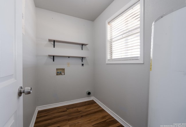 10886 Macaway Rd, Adkins, TX 78101 - laundry area featuring hookup for an electric dryer, hookup for a washing machine, dark wood-type flooring, and baseboards