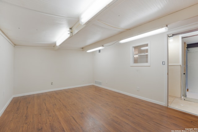 basement featuring wood-type flooring