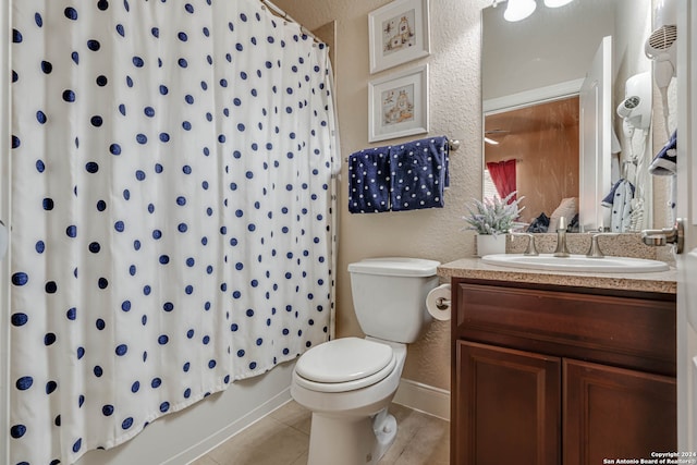 full bathroom featuring vanity, toilet, tile patterned floors, and shower / bath combination with curtain