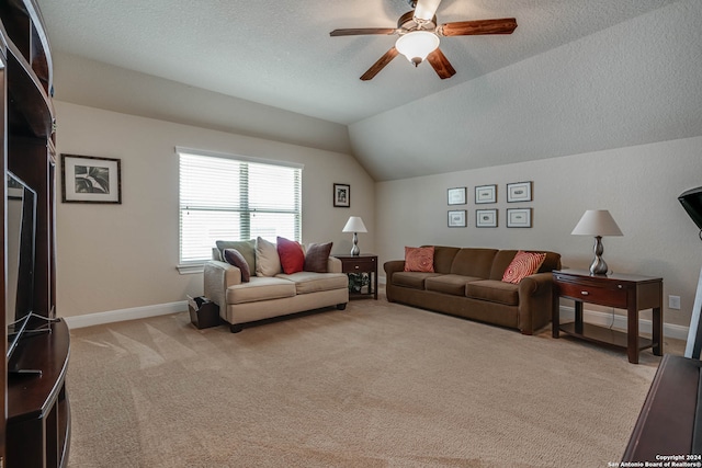 carpeted living room with a textured ceiling, ceiling fan, and vaulted ceiling