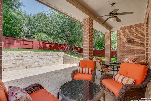 view of patio / terrace featuring an outdoor living space and ceiling fan