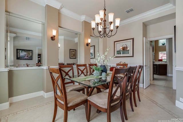 tiled dining area featuring an inviting chandelier and crown molding