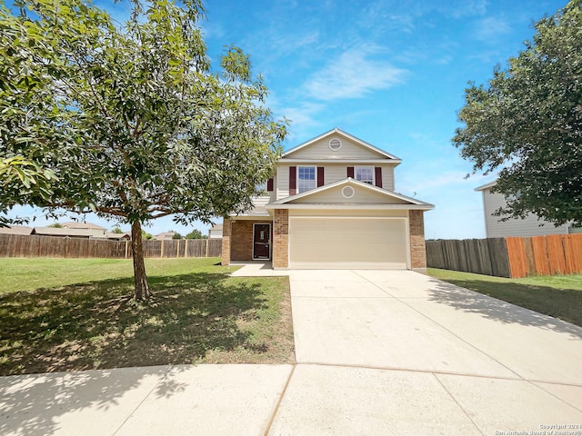 view of front facade with a garage and a front lawn