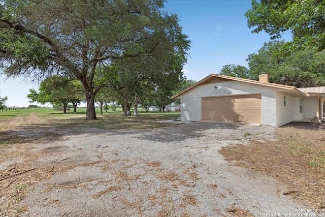 view of side of home with a garage