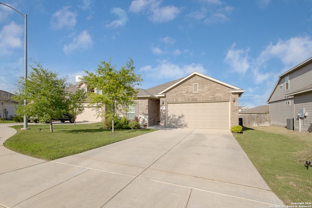 view of front facade featuring a garage, central air condition unit, and a front lawn