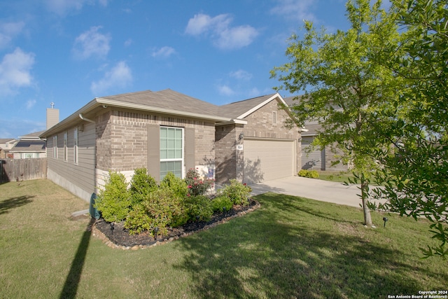 ranch-style house with a garage and a front lawn