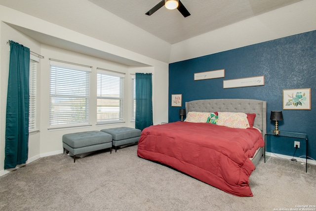 bedroom with carpet floors, a textured ceiling, and ceiling fan