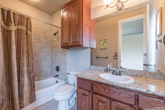 full bathroom with vanity, shower / tub combo, and toilet