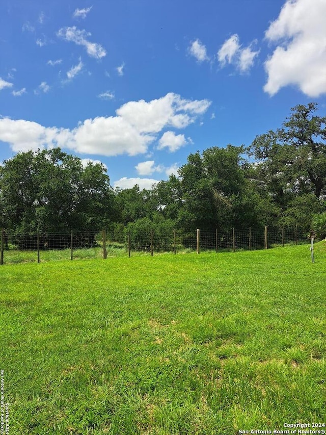 view of yard with a rural view