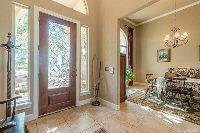 tiled foyer entrance with a wealth of natural light and ornamental molding