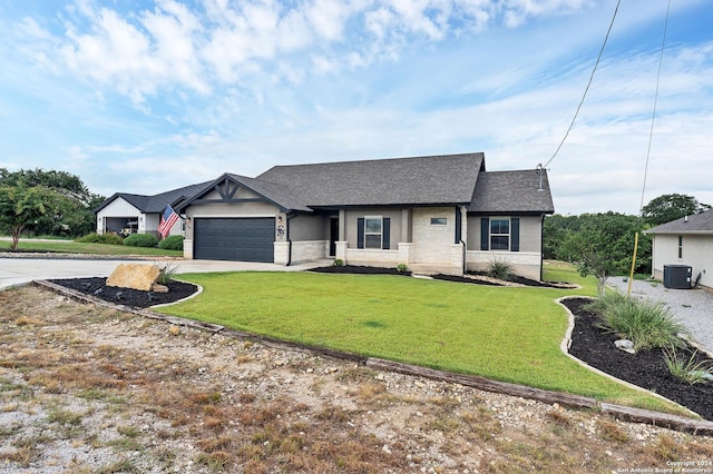 view of front of home with a garage and a front lawn