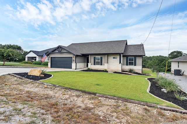 ranch-style house with a garage, central AC, and a front lawn