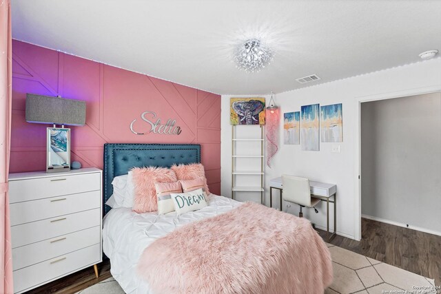 bedroom featuring dark wood-type flooring