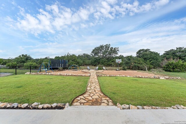 view of yard featuring a trampoline