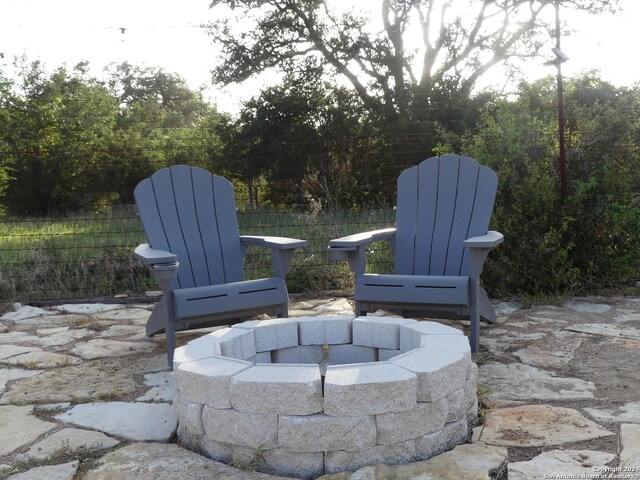 view of patio with a fire pit