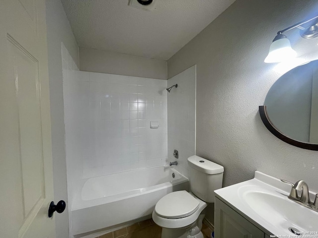 bathroom with a textured ceiling, a textured wall, toilet, shower / bath combination, and vanity