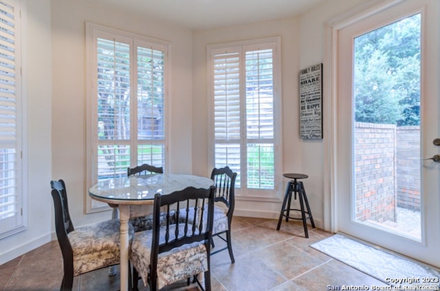 dining area with light tile patterned floors