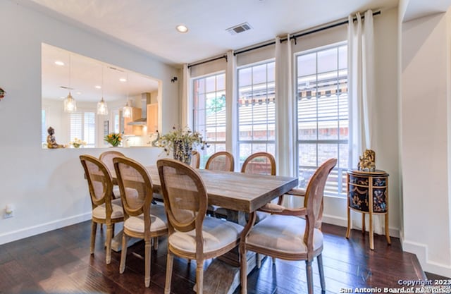 dining space featuring dark hardwood / wood-style floors