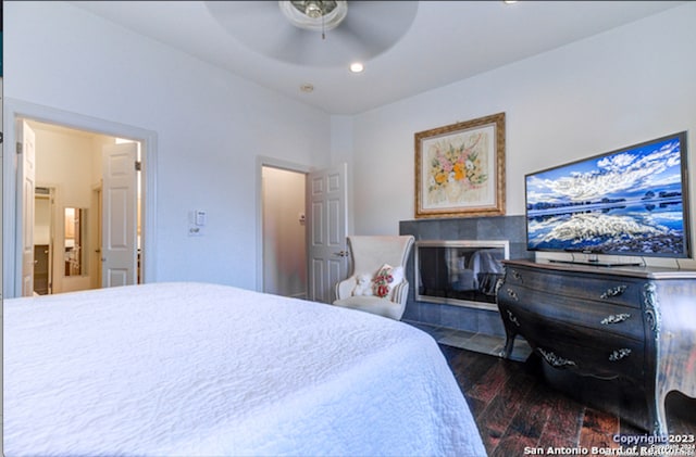 bedroom featuring ceiling fan and dark hardwood / wood-style flooring