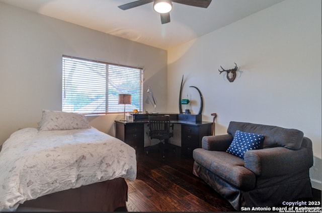 bedroom with ceiling fan and dark hardwood / wood-style flooring