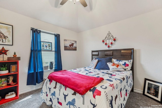 bedroom featuring ceiling fan, lofted ceiling, and dark colored carpet