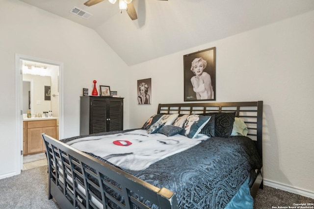 bedroom with vaulted ceiling, ensuite bathroom, ceiling fan, and carpet