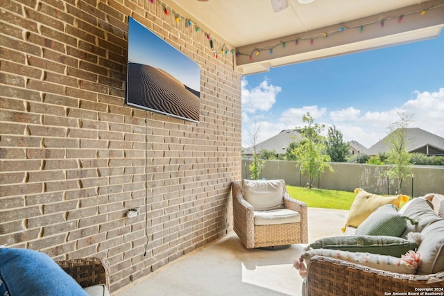 exterior space featuring ceiling fan and a patio