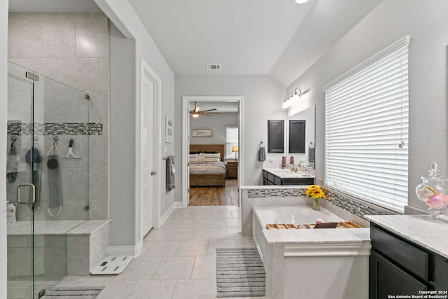 bathroom featuring ceiling fan, vanity, plus walk in shower, and tile patterned flooring