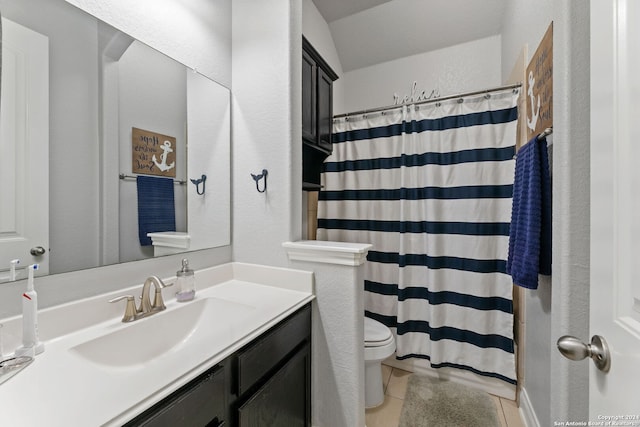 bathroom featuring walk in shower, tile patterned floors, toilet, and vanity