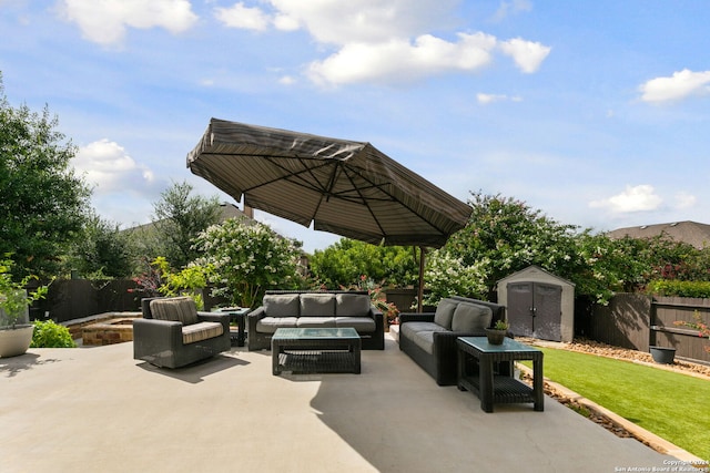 view of patio with a shed and outdoor lounge area