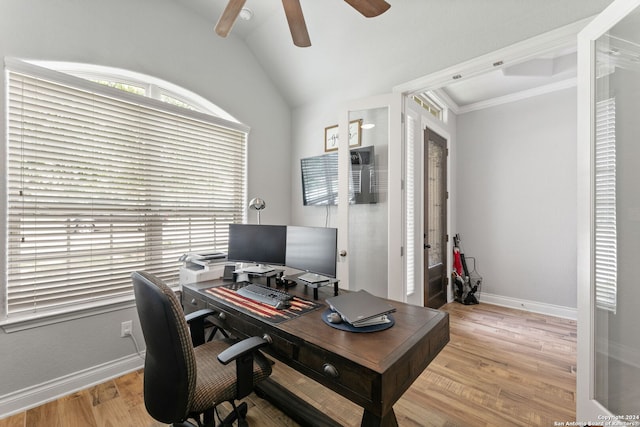 office space featuring ceiling fan, lofted ceiling, crown molding, and light wood-type flooring