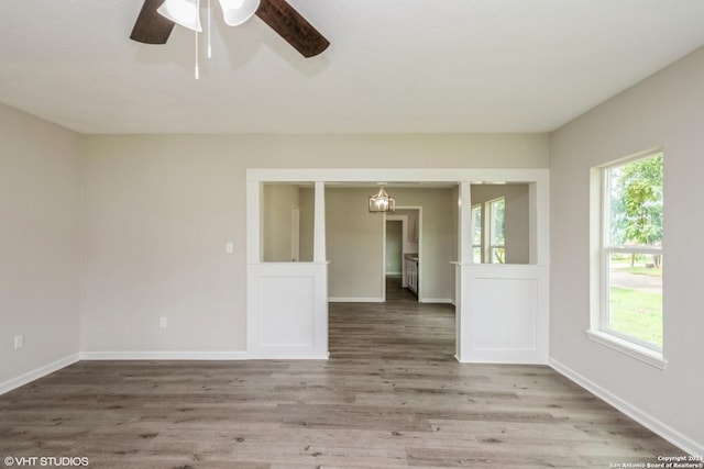 empty room featuring hardwood / wood-style floors and ceiling fan