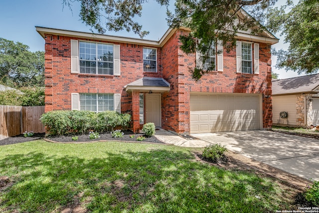 view of front of home featuring a garage and a front lawn