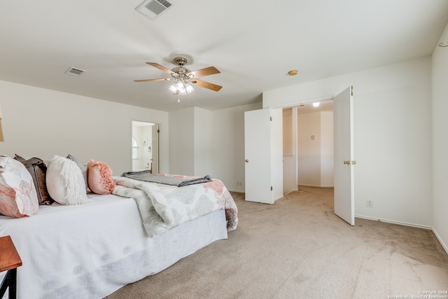 carpeted bedroom with ceiling fan