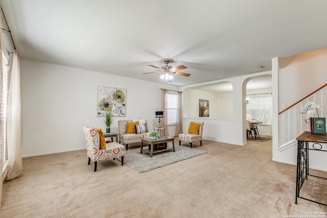 sitting room with light carpet and ceiling fan