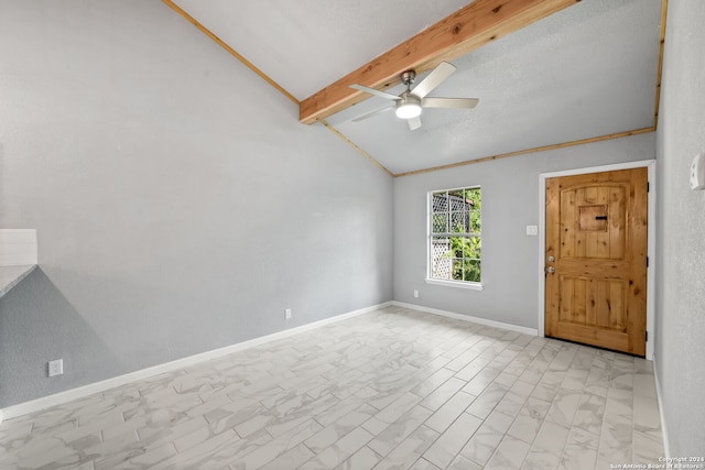 tiled spare room with a textured ceiling, lofted ceiling with beams, and ceiling fan