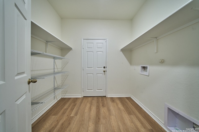 washroom featuring hardwood / wood-style flooring and hookup for a washing machine