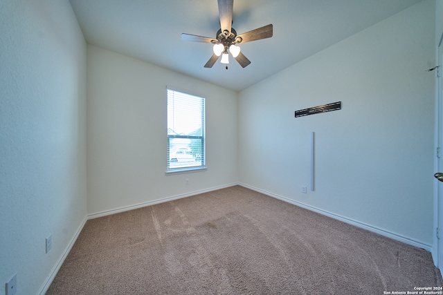 carpeted empty room featuring ceiling fan