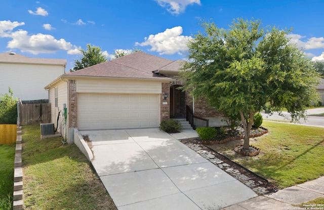 ranch-style house with a garage and a front lawn